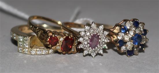 Four 9ct gold and gem set dress rings.